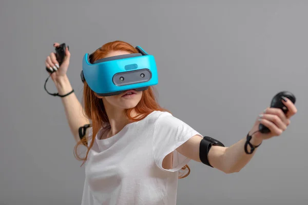 Redhead girl using VR glasses isolated over white. Virtual reality experience — Stock Photo, Image