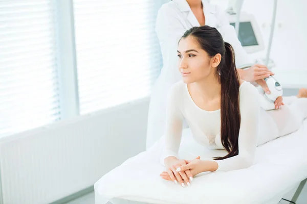 Beautiful brunette woman getting LPG massage for lifting body in LPG suit — Stock Photo, Image
