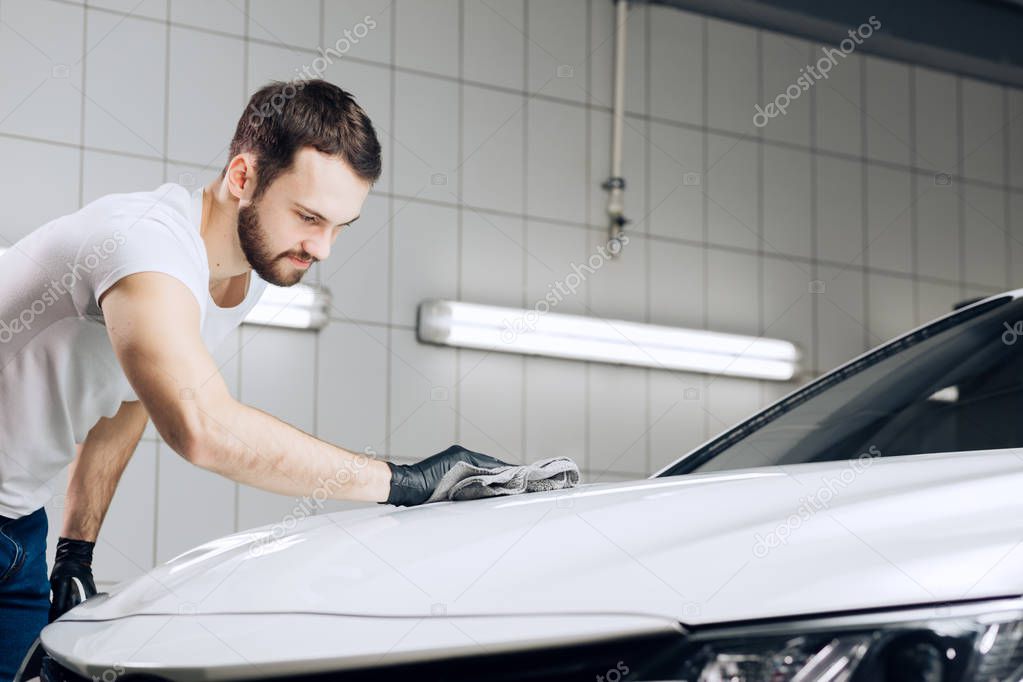 guy finishing to wash his vehicle