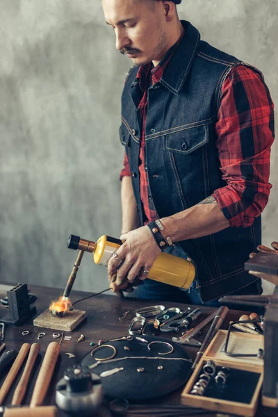 Craftsman concentrated on working with flame — Stock Photo, Image