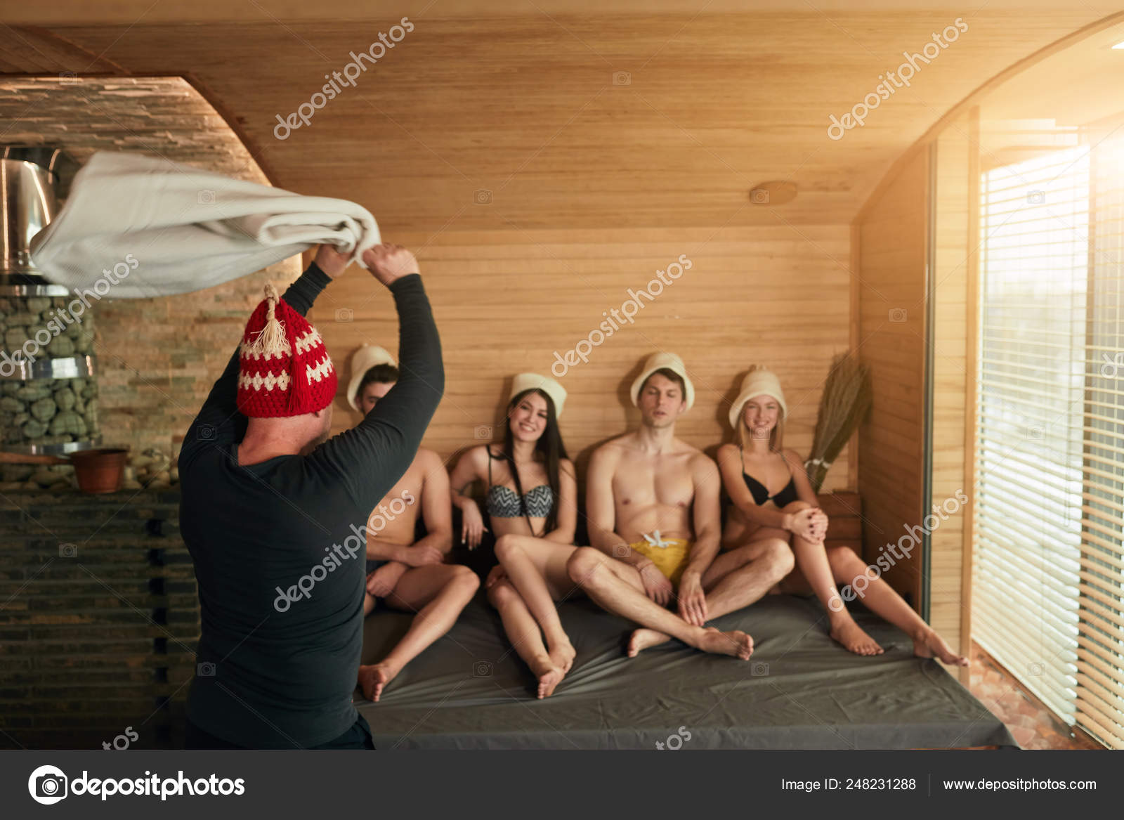 Group Of Friends In A Traditional Russian Steam Room With