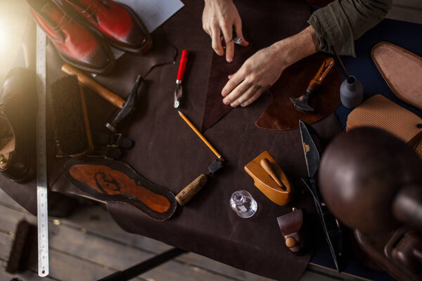 top view photo. shoemakers tools for fixing footwear