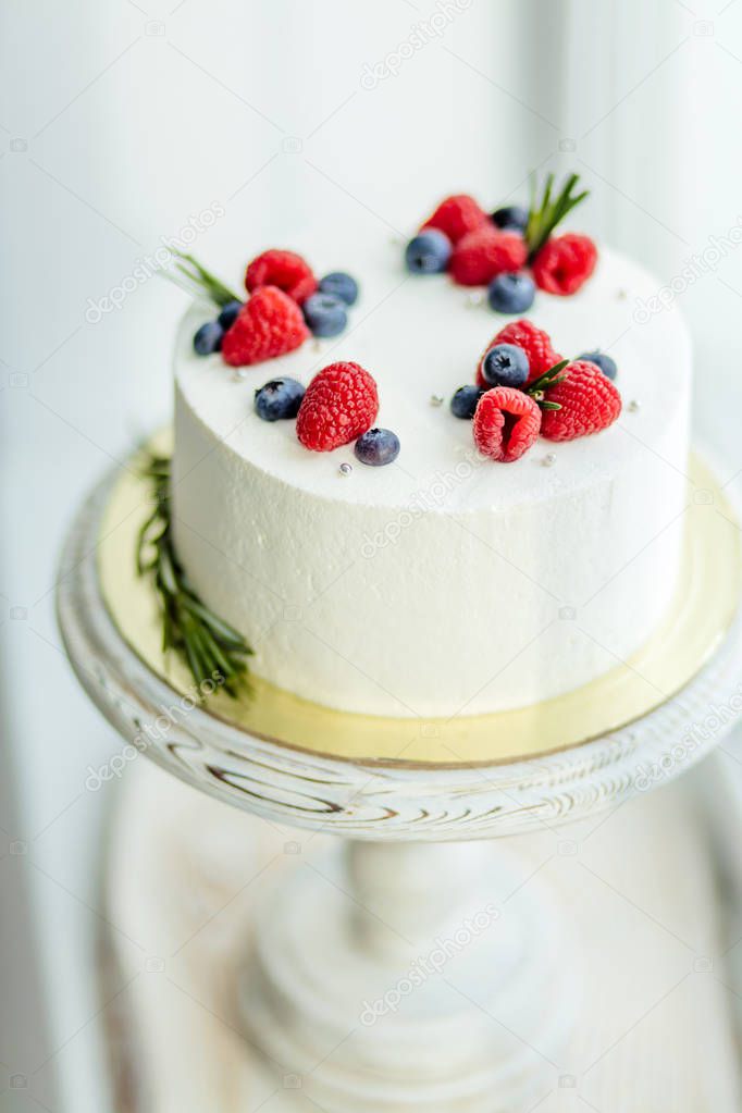 wonderful white cream cake decorated with different berries