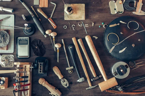 Table is full of tools for making, repairing adornmnet — Stock Photo, Image