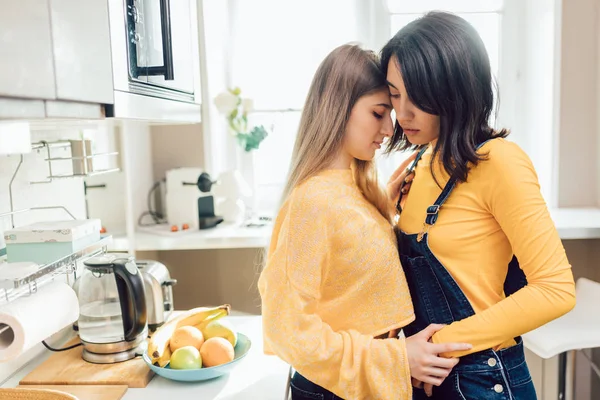 Girls greeting each other with a kiss in the morning — Stock Photo, Image