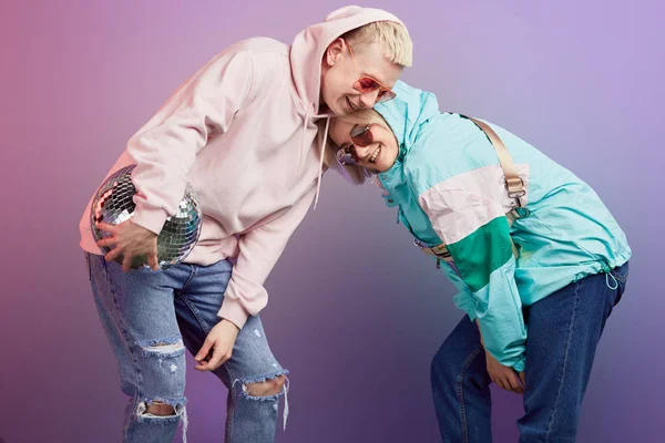 Couple of young emotional people man and woman on red background — Stock Photo, Image