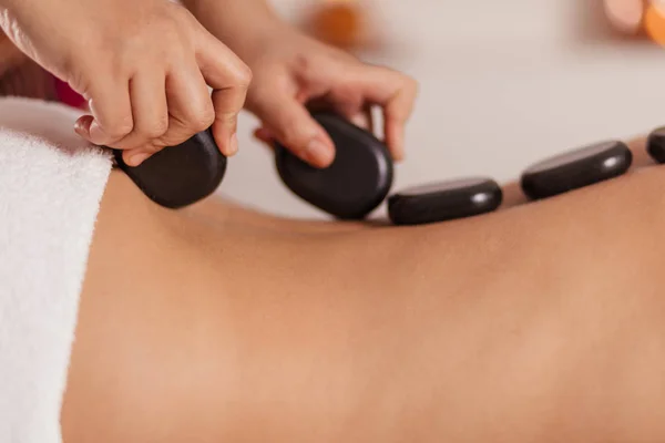 Talented beautician massaging girls back — Stock Photo, Image