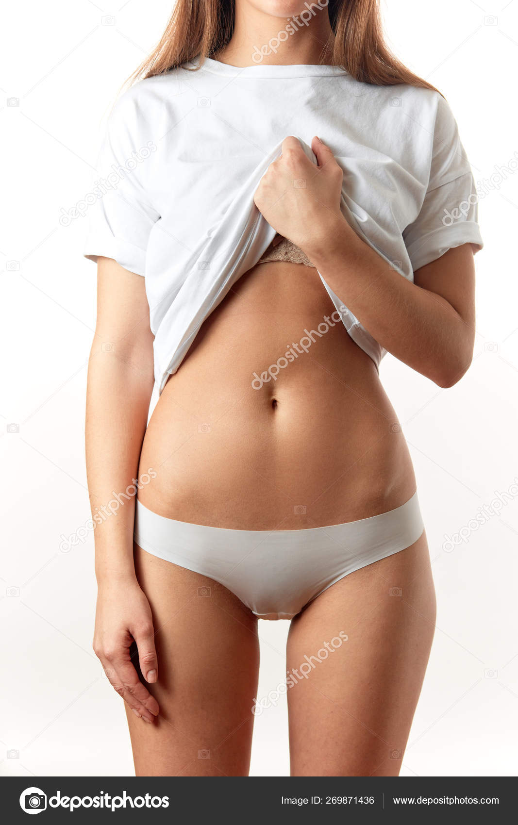 Beautiful woman in underwear testing fat layer on waist. Stock Photo by  ©ufabizphoto 269871436