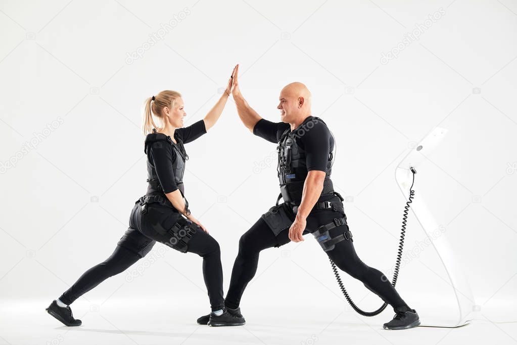 positive fit man and woman holding their hands