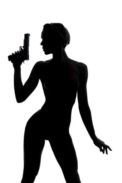 Σέξι γυναίκα οικοδόμος θηλυκό φόνο κρατώντας ένα πιστόλι στο χέρι — Φωτογραφία Αρχείου