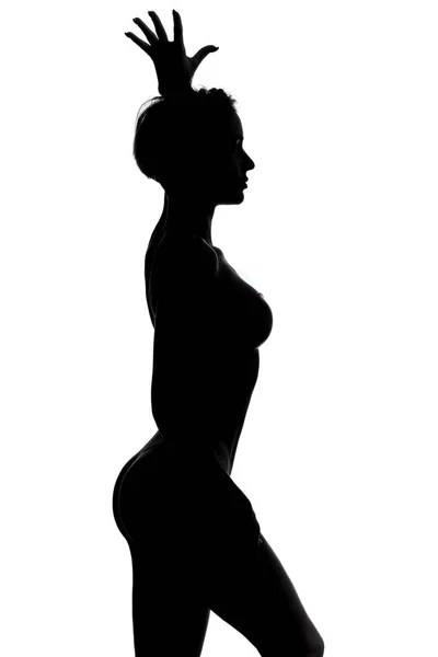 Сексуальна стриптиз танцівниця стоїть над білим тлом, студійний знімок — стокове фото