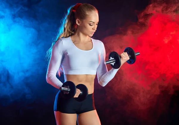 Athletic beautiful young woman doing fitness workout with dumbbells — Stock Photo, Image