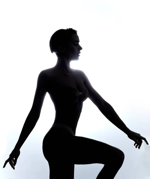 Slim woman un underwear jumping in the studio — Stock Photo, Image