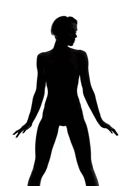 Slim girl standing wide-legged over white background — Stock Photo, Image