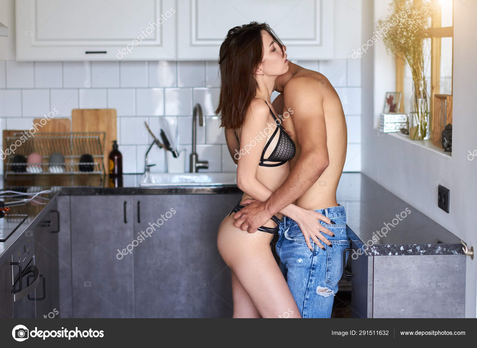 Young passionate couple having sex in the kitchen Stock Photo by ©ufabizphoto 291511632