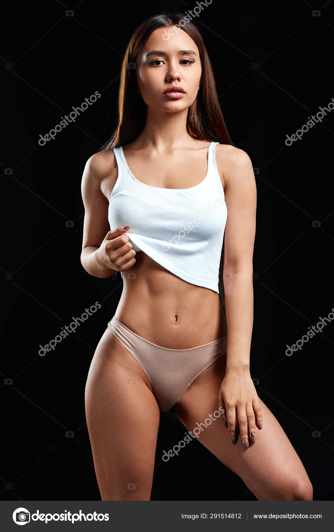 fitness woman shows her belly Photo by ©ufabizphoto 291514812