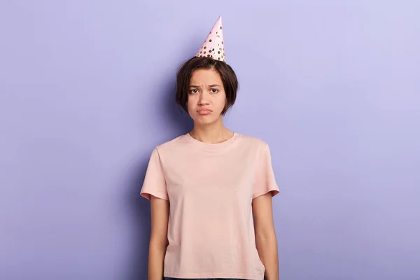 Disappointed unhappy beautiful girl feels lonely on her birthday,