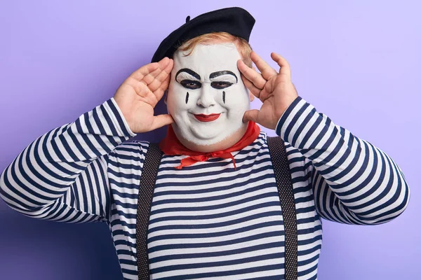 Playful funny plump man touching his face with fingers looking at the camera — Stock Photo, Image