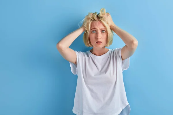 Student touching her hair, being shocked with results of exams — Stock Photo, Image