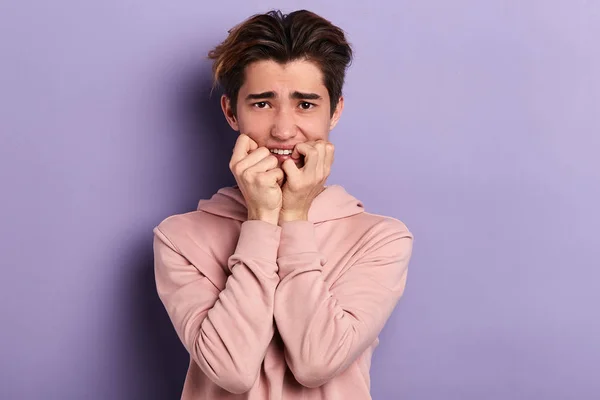 Nervous student biting his nails, waiting for results of exams — Stock Photo, Image