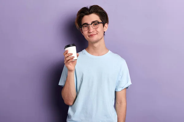 Pleasant young man enjoying drinking tea — Stock Photo, Image