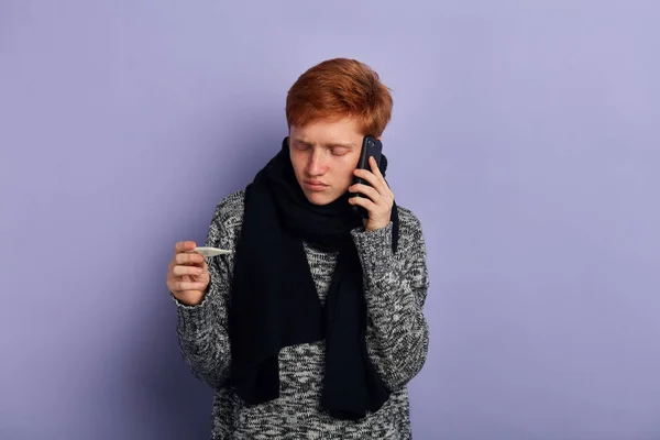 young unhappy sad man making a phone call. Cold and Sickness