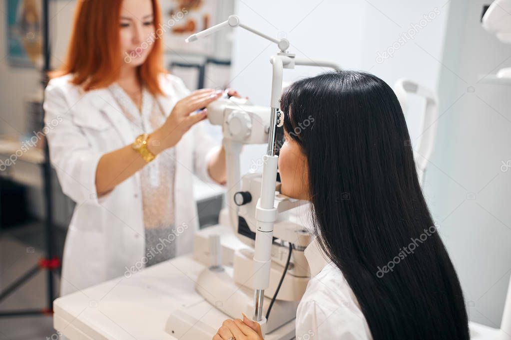 brunette woman having eyes examination