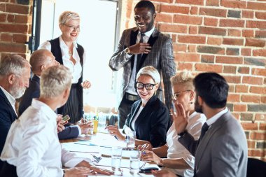 Business people at the negotiating table in the office clipart