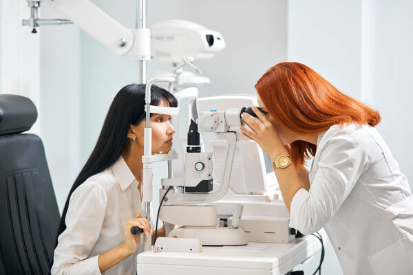 giger doctor measuring the eyesight of patient