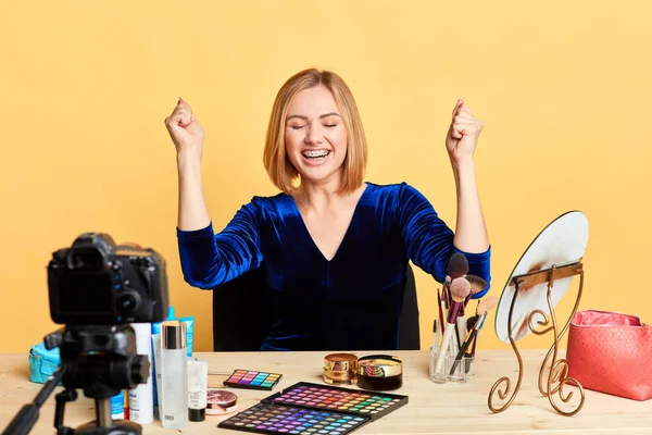 Happy female beauty fashion blogger clenching fists, celebrating success — Stock Photo, Image