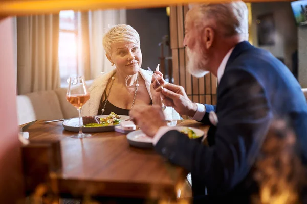 Mature couple fine dining food in hotel or elegant expensive restaurant — ストック写真