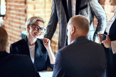 Business people at the negotiating table in the office clipart