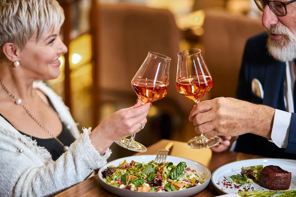 Modern couple have dinner and celebrate in restaurant