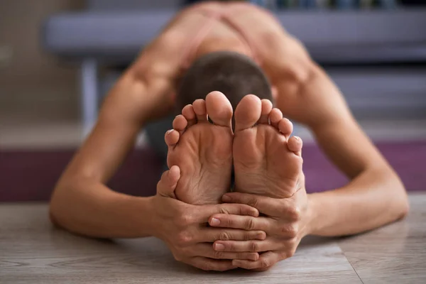 Beautiful female feet while stretching. Yoga