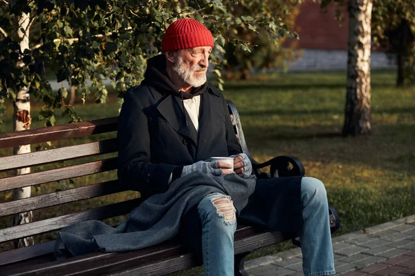 Grey bearded old man sit on bench at morning — Stock Photo, Image