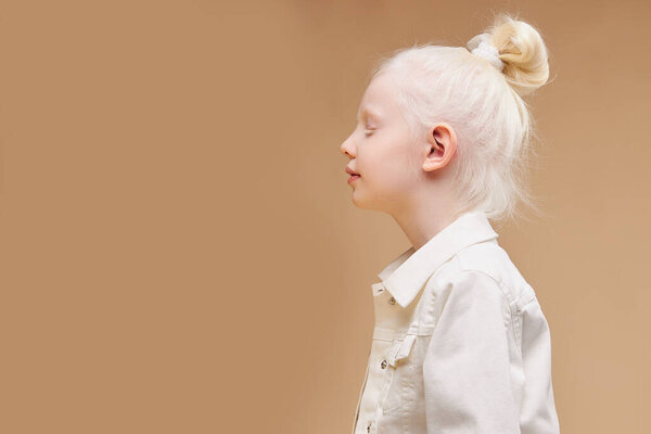 strange little girl with unusual appearance, alien concept. albino