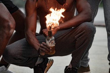 black man set fire on the bottle, protests over George Floyd death clipart