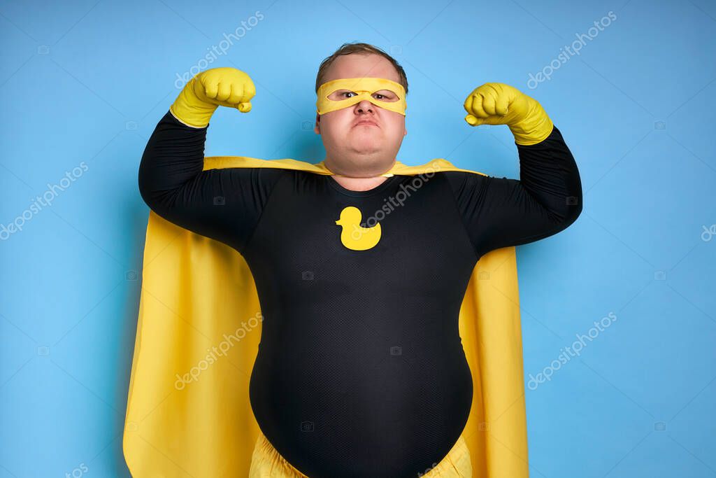 Fat funny superhero will defeat everyone, man shows his power and strength, his muscles can be envied
