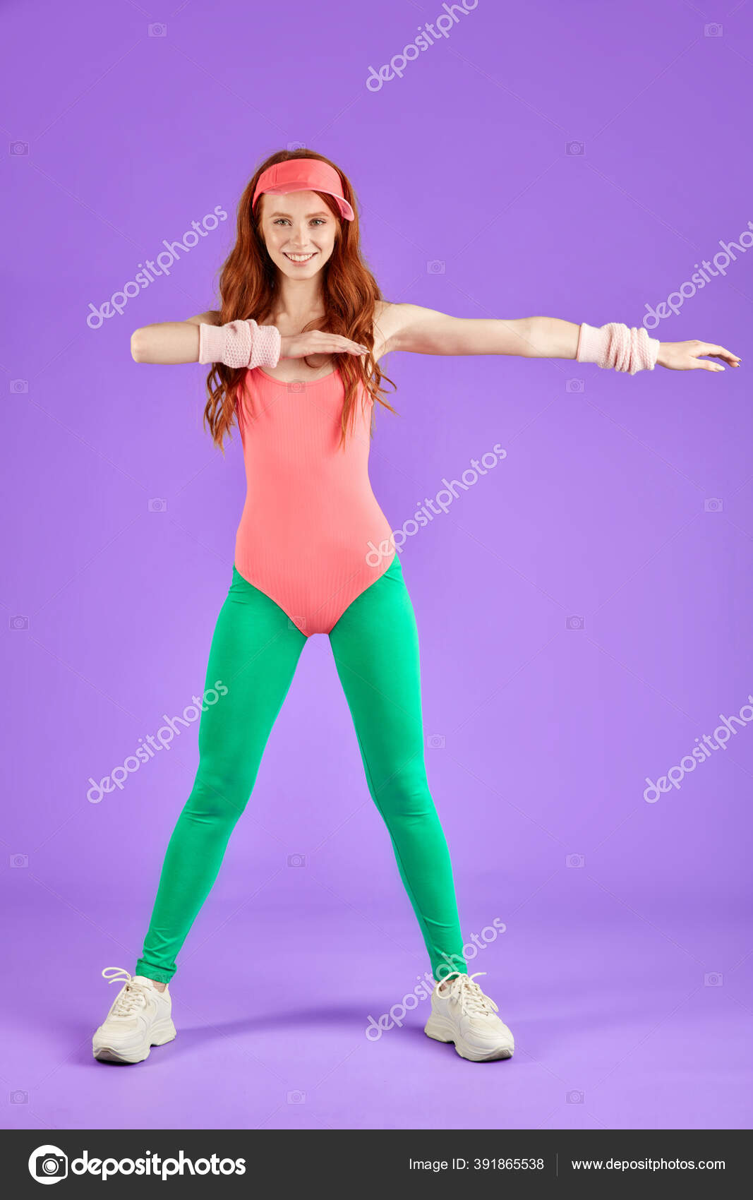 Red-headed girl wears aerobics clothes in 80s style looks in