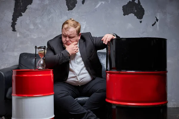 Upset caucasian man is saddened by oil prices — Stock Photo, Image
