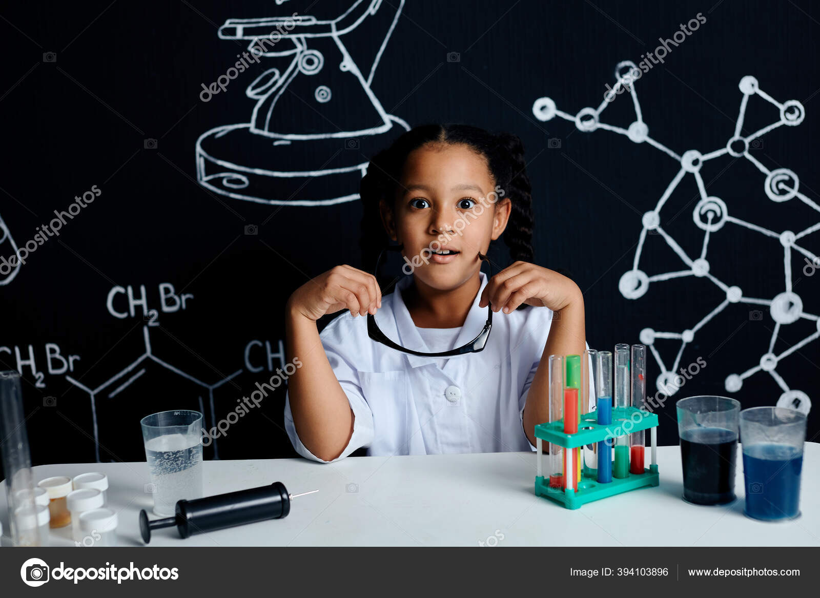 Group of kids and teachers carrying out a science experiment