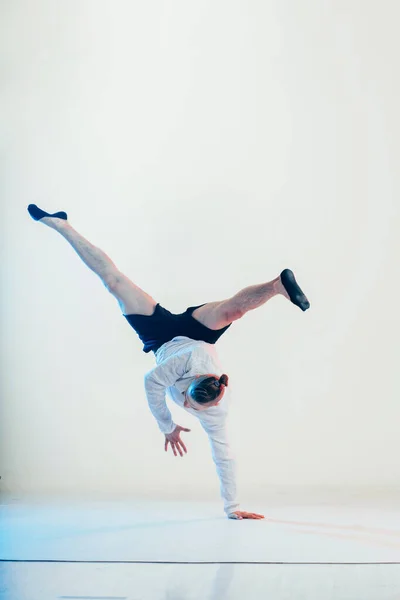 Young hip-hop dancer posing at studio