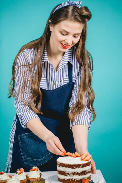 Woman decorating delicious cake