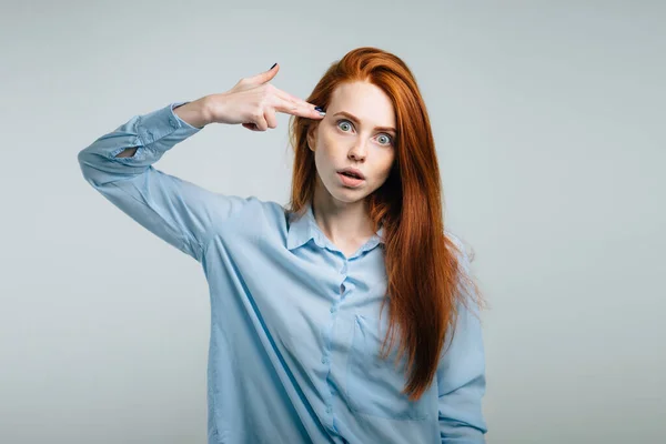 Teenage woman committing suicide with finger gun gesture — Stock Photo, Image