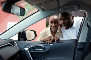 wow, look, what a chic car african couple is interested in auto clipart