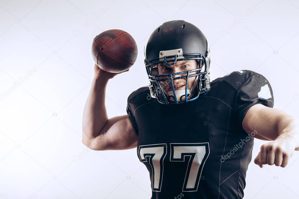 Quarterback throwing a football in a professional football game