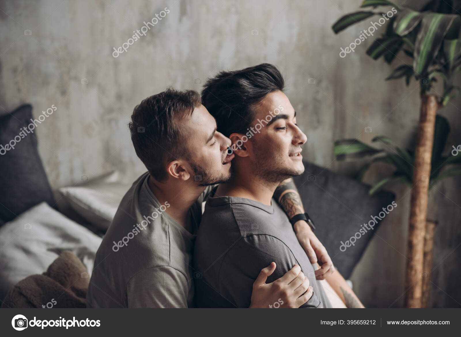 Two sexy caucasian gay guys hugging and having fun in bed indoors Stock Photo by ©ufabizphoto 395659212