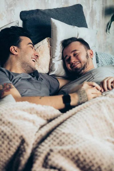 Positive delighted non-traditional couple sleeping together — Stock Photo, Image