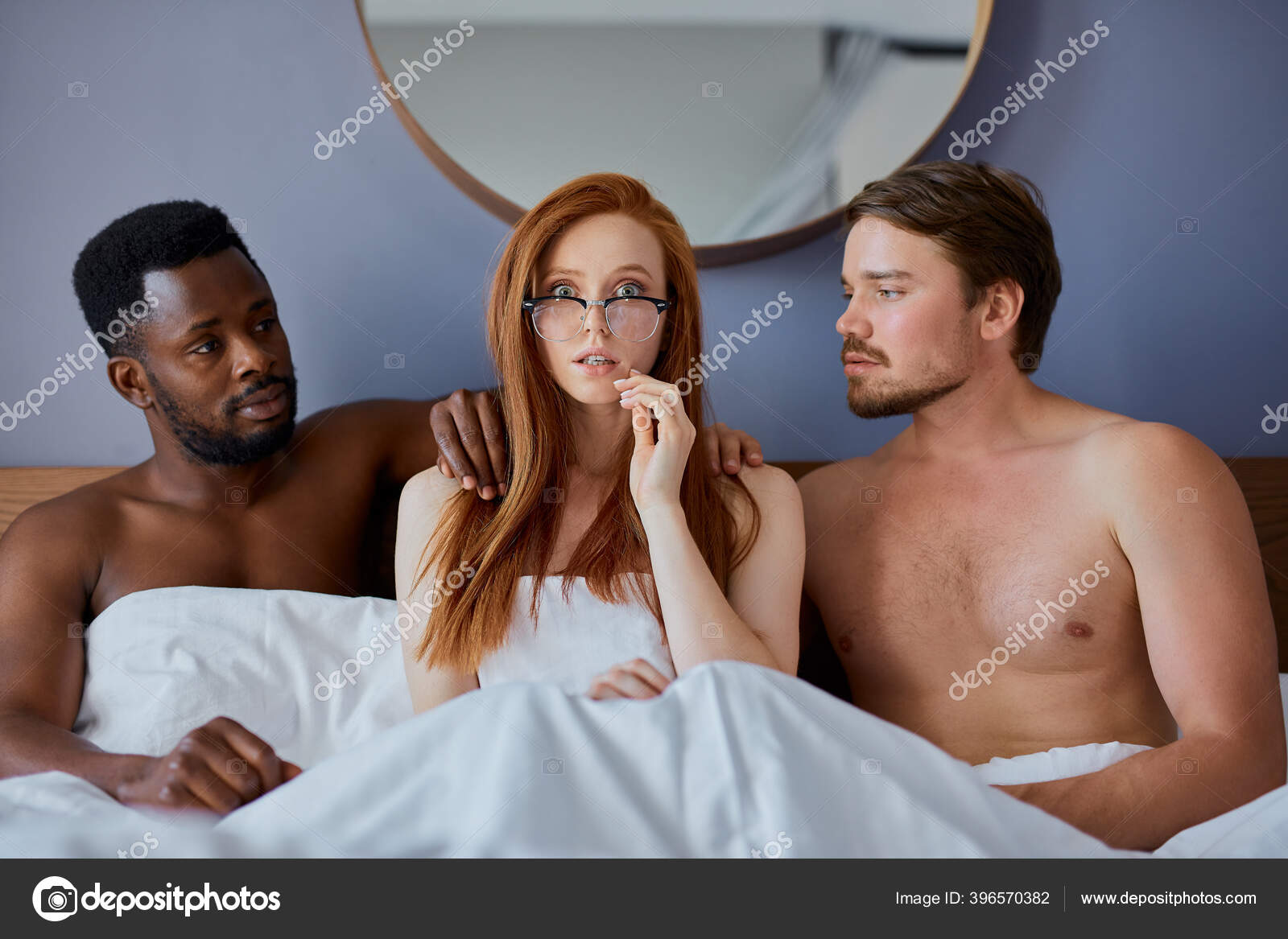 Woman is molested by two men, she is shy and afraid Stock Photo by ©ufabizphoto 396570382 photo