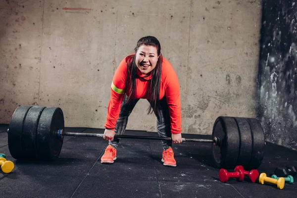 crazy angry fat woman lifting the barbell